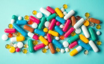 Illustration showing a variety of capsules and medications on a vibrant background, emphasizing health and wellness.